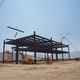 Construction continues apace. The crane lifts three massive steel bars at a time in the interest of speed and efficiency. Photo credit: Michael Ballaban/Jalopnik